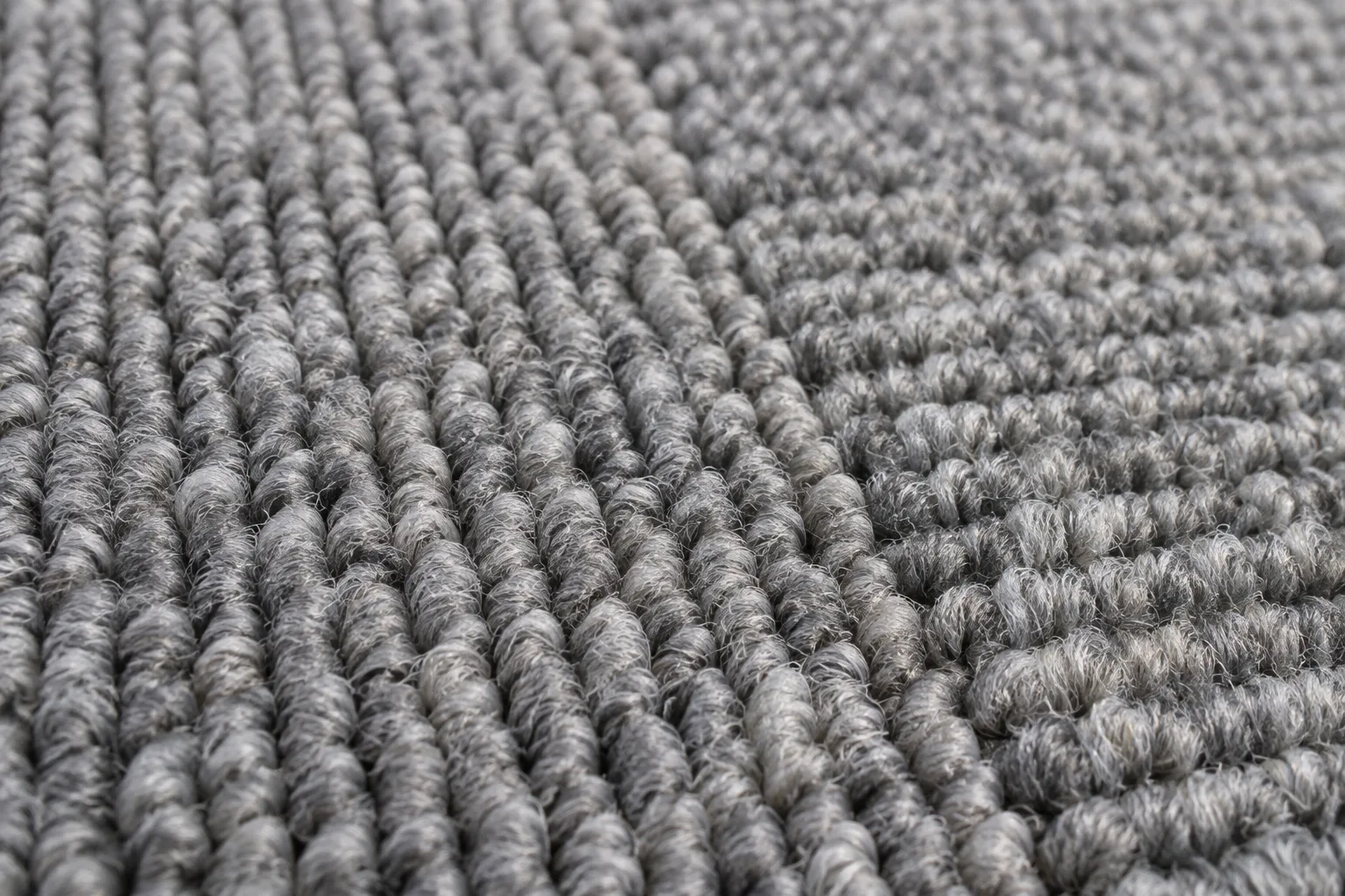 Tuft rows on a neutral grey carpet surface