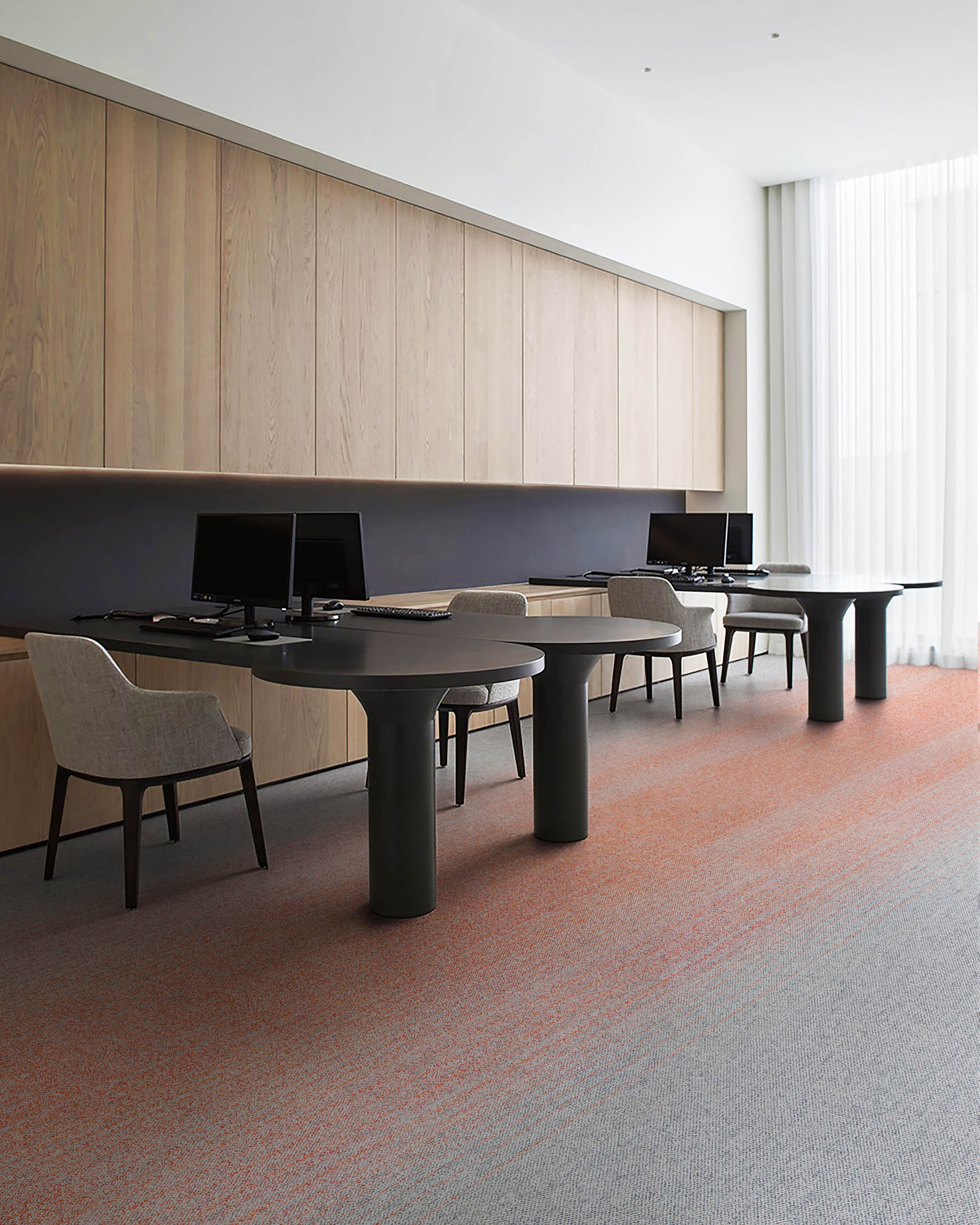 UNIJOY carpet tile installation in a large open office with repeated linear modules, used as verified visual context for layout planning